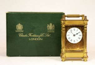 A brass 8 day carriage clock, by Charles Frodsham of London, complete with original box, 13cm tall.