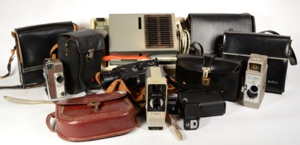 A collection of early 20th century and later vintage technology, including various cine cameras,