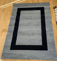 A contemporary brown woolen mix abstract pattern rug, 240x159cm, together with grey and black