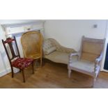 A floral upholstered chaise longue, 130cm, two wicker chairs with a mahogany hall chair, and a