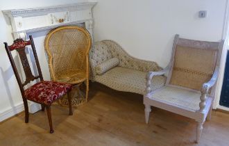 A floral upholstered chaise longue, 130cm, two wicker chairs with a mahogany hall chair, and a