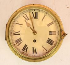 A brass bulkhead clock, with 8 day movement, unnamed, 20cm diameter.