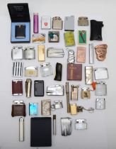 A large collection of pocket cigarette lighters, circa 1950 - 1980s, petrol and gas operated.