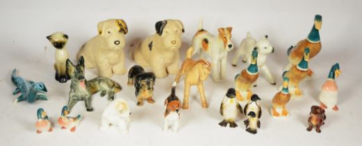 A collection of pottery animal models, makers to include Sylvac, Beswick and Goebel.