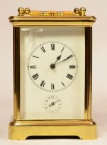 A French brass repeater carriage clock, the enamelled dial with Roman numerals, housing 8 day