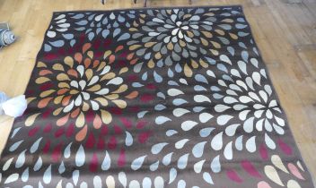 A contemporary brown background silk mix rug, with leaf style decoration, 295x193cm together with a