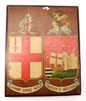 A pre 1923 grouping G.W.R emblem/coat of arms, painted on a mahogany board, 34x28cm.