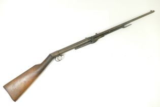 An early 20th century BSA .22 underlever air rifle with walnut stock, serial number 10018. This
