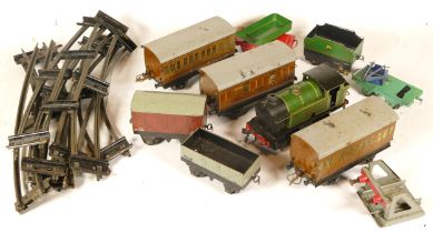 Hornby, a tin plate 0 gauge clockwork LNER 466 locomotive, with track, haulage and carriges.