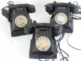 Three 20th century black Bakelite electric telephones, each with chrome plated dialing plates