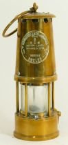 A brass miners lamp, by Eccles having attached makers plaque, 24cm tall.