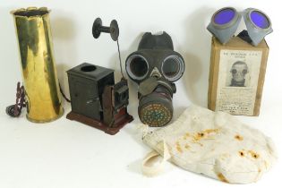 An early 20th century tinplate combined magic lantern and 35mm cinematograph projector, hand-