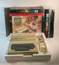 A late 20th century boxed Data Dragon 32 Family computer.