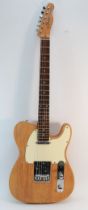 A Fender Telecaster guitar in natural ash with maple neck, pat 2573254/3143028, 97cm long.