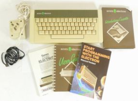 A 20th century boxed Acorn Electron computer, complete with instructions and other related books