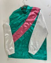 Racing silks of the late Prince Abdallah (Frankel Dancing Brave) presented by Sir Henry Cecil on a