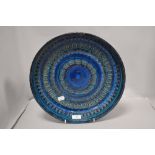 A mid century Italian Aldo londi for Bitossi ceramic Rimini blue charger of large form, marked to