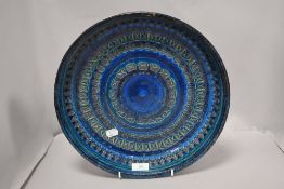 A mid century Italian Aldo londi for Bitossi ceramic Rimini blue charger of large form, marked to