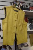 A 1970s yellow leather waistcoat, smaller size.