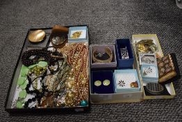 An assortment of vintage and modern costume jewellery, compacts and cuff links.