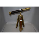 A modern telescope having mahogany and brass tripod, no makers mark.