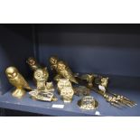 A large collection of brass owl studies, including door knocker, toasting forks and more.