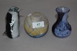 A Korurangi glass penguin paper weight, an Isle of White paper weight and a Caithness bud vase.