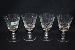 A set of four Stewart crystal wine glasses.