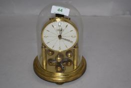 A mid century German made Cresta Anniversary clock having glass dome.