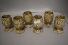 A set of six natural stone goblets.