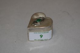 A 925 grade white metal trinket box having Celtic design with green gem stone to centre.