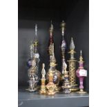 A collection of fine Eygyptian glass perfume bottles including smaller examples, coloured glass