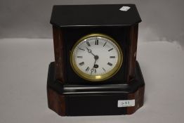 A Victorian French slate and red marble insert mantel clock with eight day movement