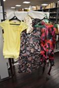 A mixed lot of ladies clothing, including vintage styles and modern brands.