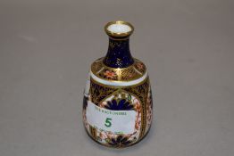 A small Royal Crown Derby bud vase of baluster form in the Imari pallet, marked to underside with