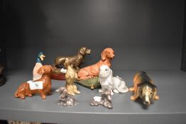 A menagerie of dog studies and a duck, including Beswick Dachshund in brown gloss finish and Tudor