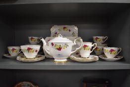 A Royal Stafford 'summer day' partial tea service having pink and yellow rose bud pattern, including