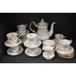 A mid century Paragon Victoriana Rose partial coffee service, comprising of coffee pot, cups and