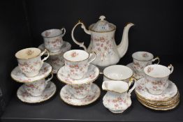 A mid century Paragon Victoriana Rose partial coffee service, comprising of coffee pot, cups and