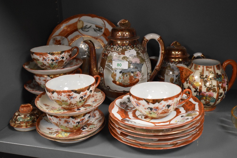 A vintage Japanese Satsuma partial tea service comprising of cups, saucers, tea pot plates and