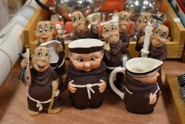 A collection of collectable novelty monk figurines and jugs, including Goebel with Bee back stamp.