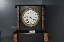 A Victorian French marble striking mantel clock, unmarked movement ,dial having had repairs.