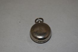 A silver plated sovereign case, of hinged circular form with sprung interior, 4cm. Some losses to