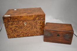 An antique tea caddy having two internal compartments and a larger highly figured box of Hungarian