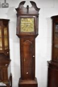 An 18th Century oak longcased clock having 30hr movement and brass dial named for Lomax Blackburn