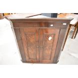 A 19th Century mahogany corner wall cupboard