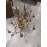 Two large brass Dutch style chandelier type light fittings, with double eagle head surmounts and