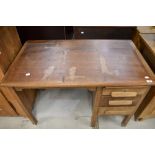 An early 20th Century oak office desk, width approx. 105cm