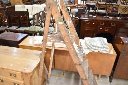 A set of vintage wooden decorators step ladders