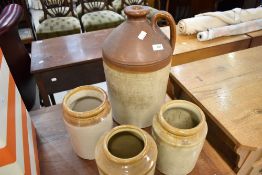 A glazed earthenware flagon and three similar jars